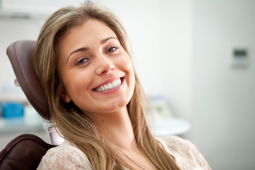 Woman smiling in dental chair at Cascade Dental in Medford, OR